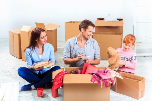 Packed moving boxes and furniture prepared for local removals in Littleilford
