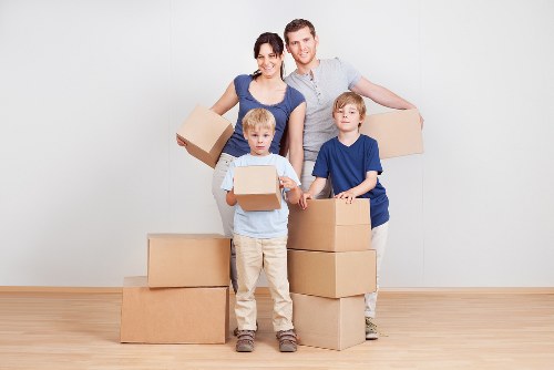 Removal workers loading household items during a Littleilford relocation