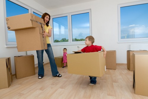 Labelled moving boxes ready for house removals in Littleilford