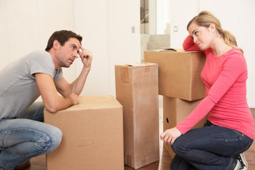 Person closing a storage unit after use