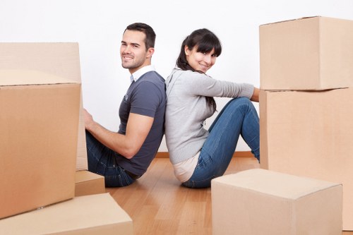 Loading household items into a van for a Littleilford move
